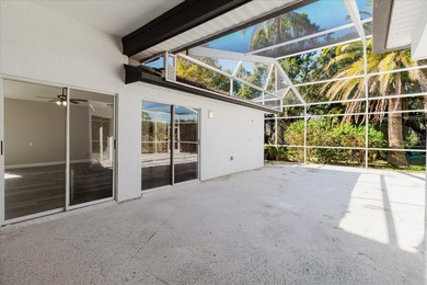 Short Sale. Step into this stunning split-floor plan residence on Tarpon Springs Golf Course in Florida - for sale on GolfHomes.com, golf home, golf lot