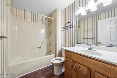 Easy one-story living in the heart of Pinehurst. This 3-bedroom on Pinehurst Resort and Country Club in North Carolina - for sale on GolfHomes.com, golf home, golf lot