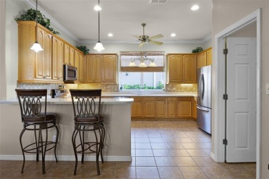 Step into the lifestyle you've been dreaming of in the vibrant on Plantation Golf Club in Florida - for sale on GolfHomes.com, golf home, golf lot