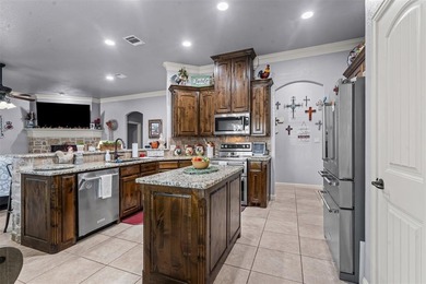 Welcome to this meticulously maintained, single-story on Pecan Plantation Country Club in Texas - for sale on GolfHomes.com, golf home, golf lot