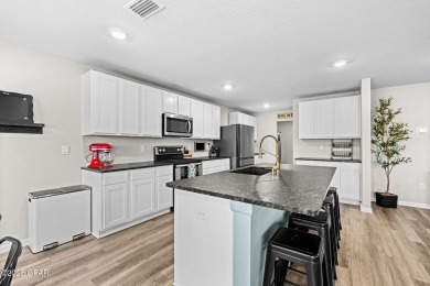 This exquisite 5-bedroom, 4-bathroom home boasts 4,128 sq/ft of on Bay Dunes in Florida - for sale on GolfHomes.com, golf home, golf lot