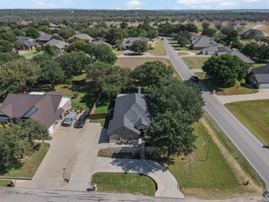 Welcome to this meticulously maintained, single-story on Pecan Plantation Country Club in Texas - for sale on GolfHomes.com, golf home, golf lot