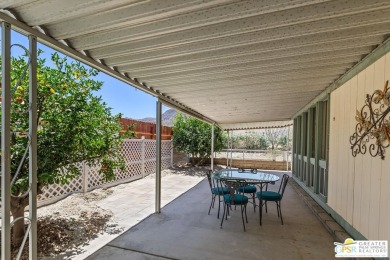 Dramatic mountain views enhance this open and light home behind on Date Palm Country Club in California - for sale on GolfHomes.com, golf home, golf lot