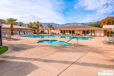 Dramatic mountain views enhance this open and light home behind on Date Palm Country Club in California - for sale on GolfHomes.com, golf home, golf lot