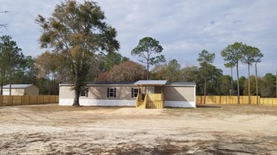 Affordable Living In Freeport w/ Large Lot (0.72 Acres). New on Windswept Dunes Golf Club in Florida - for sale on GolfHomes.com, golf home, golf lot