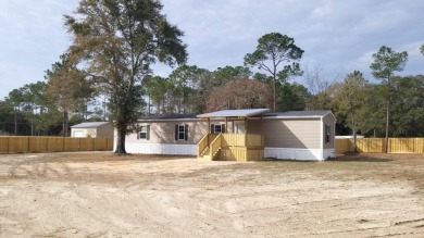 Affordable Living In Freeport w/ Large Lot (0.72 Acres). New on Windswept Dunes Golf Club in Florida - for sale on GolfHomes.com, golf home, golf lot