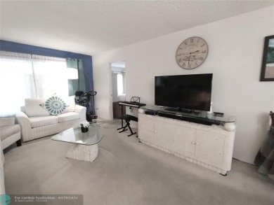 LOVELY 2ND STORY, CORNER 2BR/2BTH CONDO IN THE PEACEFUL BAHAMA on Wynmoor Golf Course in Florida - for sale on GolfHomes.com, golf home, golf lot