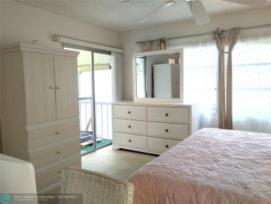 LOVELY 2ND STORY, CORNER 2BR/2BTH CONDO IN THE PEACEFUL BAHAMA on Wynmoor Golf Course in Florida - for sale on GolfHomes.com, golf home, golf lot