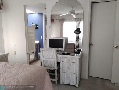 LOVELY 2ND STORY, CORNER 2BR/2BTH CONDO IN THE PEACEFUL BAHAMA on Wynmoor Golf Course in Florida - for sale on GolfHomes.com, golf home, golf lot