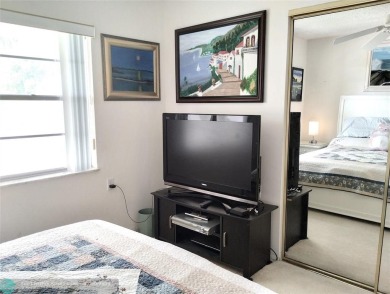 LOVELY 2ND STORY, CORNER 2BR/2BTH CONDO IN THE PEACEFUL BAHAMA on Wynmoor Golf Course in Florida - for sale on GolfHomes.com, golf home, golf lot