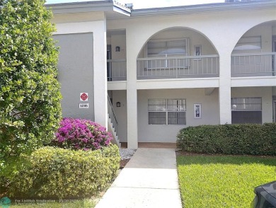 LOVELY 2ND STORY, CORNER 2BR/2BTH CONDO IN THE PEACEFUL BAHAMA on Wynmoor Golf Course in Florida - for sale on GolfHomes.com, golf home, golf lot