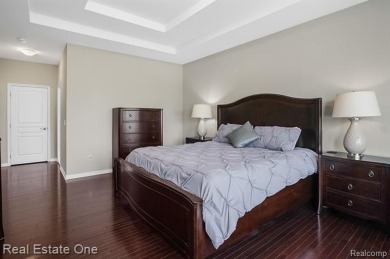 Custom built ranch with finished basement & a covered 288 sf on The Orchards Golf Club in Michigan - for sale on GolfHomes.com, golf home, golf lot