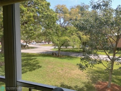 LOVELY 2ND STORY, CORNER 2BR/2BTH CONDO IN THE PEACEFUL BAHAMA on Wynmoor Golf Course in Florida - for sale on GolfHomes.com, golf home, golf lot