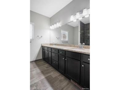 Custom built ranch with finished basement & a covered 288 sf on The Orchards Golf Club in Michigan - for sale on GolfHomes.com, golf home, golf lot