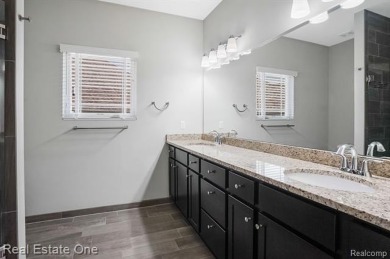 Custom built ranch with finished basement & a covered 288 sf on The Orchards Golf Club in Michigan - for sale on GolfHomes.com, golf home, golf lot