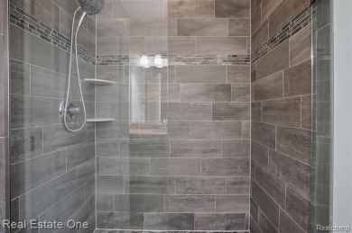 Custom built ranch with finished basement & a covered 288 sf on The Orchards Golf Club in Michigan - for sale on GolfHomes.com, golf home, golf lot