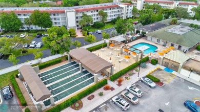 LOVELY 2ND STORY, CORNER 2BR/2BTH CONDO IN THE PEACEFUL BAHAMA on Wynmoor Golf Course in Florida - for sale on GolfHomes.com, golf home, golf lot