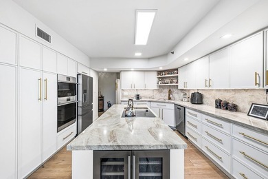 Located in a quiet gated enclave within Boca Pointe on Boca Pointe Country Club in Florida - for sale on GolfHomes.com, golf home, golf lot