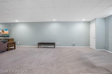 Custom built ranch with finished basement & a covered 288 sf on The Orchards Golf Club in Michigan - for sale on GolfHomes.com, golf home, golf lot