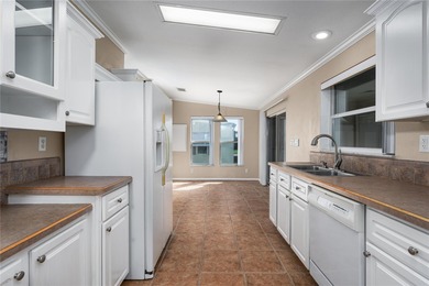 Well-Maintained 3BR Palm Harbor Home with New Roof & A/C! on Imperial Lakewoods Golf Club in Florida - for sale on GolfHomes.com, golf home, golf lot