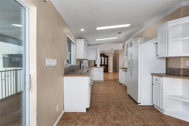 Well-Maintained 3BR Palm Harbor Home with New Roof & A/C! on Imperial Lakewoods Golf Club in Florida - for sale on GolfHomes.com, golf home, golf lot