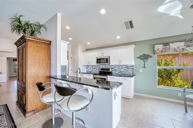 Welcome to your dream home in the prestigious Colonial Country on Colonial Country Club in Florida - for sale on GolfHomes.com, golf home, golf lot