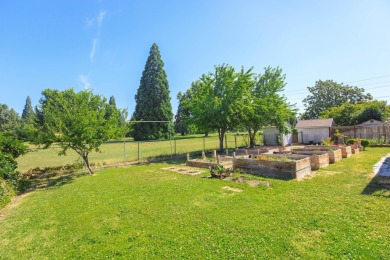 This East Medford Colonial style home with many updates sits on on Rogue Valley Country Club in Oregon - for sale on GolfHomes.com, golf home, golf lot