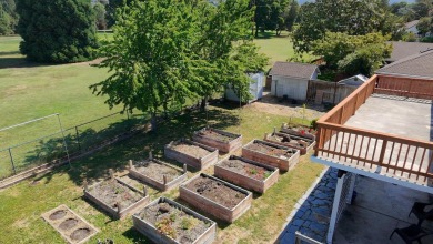 This East Medford Colonial style home with many updates sits on on Rogue Valley Country Club in Oregon - for sale on GolfHomes.com, golf home, golf lot