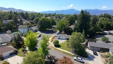 This East Medford Colonial style home with many updates sits on on Rogue Valley Country Club in Oregon - for sale on GolfHomes.com, golf home, golf lot