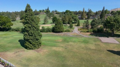 This East Medford Colonial style home with many updates sits on on Rogue Valley Country Club in Oregon - for sale on GolfHomes.com, golf home, golf lot