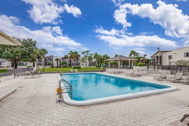 SPACIOUS ONE BEDROOM CONDO OVERLOOKING THE COURTYARD WITH ONE on BallenIsles Golf and Country Club in Florida - for sale on GolfHomes.com, golf home, golf lot