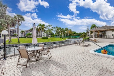 SPACIOUS ONE BEDROOM CONDO OVERLOOKING THE COURTYARD WITH ONE on BallenIsles Golf and Country Club in Florida - for sale on GolfHomes.com, golf home, golf lot
