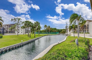 SPACIOUS ONE BEDROOM CONDO OVERLOOKING THE COURTYARD WITH ONE on BallenIsles Golf and Country Club in Florida - for sale on GolfHomes.com, golf home, golf lot