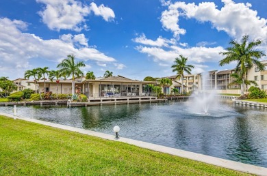 SPACIOUS ONE BEDROOM CONDO OVERLOOKING THE COURTYARD WITH ONE on BallenIsles Golf and Country Club in Florida - for sale on GolfHomes.com, golf home, golf lot