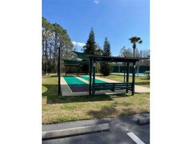 Welcome to this 3 Bedroom  2 Bath Courtyard Home WITH GOLF CART on The Groves Golf and Country Club in Florida - for sale on GolfHomes.com, golf home, golf lot