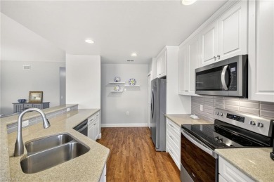 This lovely, first floor end unit coach home shows like new on Pelican Sound Golf and River Club in Florida - for sale on GolfHomes.com, golf home, golf lot