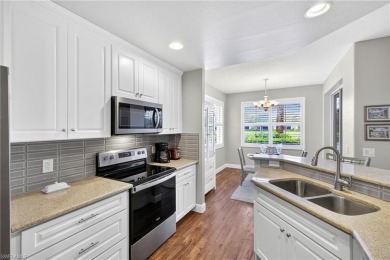 This lovely, first floor end unit coach home shows like new on Pelican Sound Golf and River Club in Florida - for sale on GolfHomes.com, golf home, golf lot