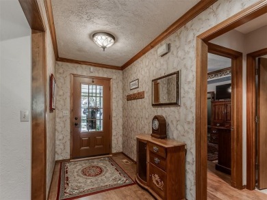 Beautiful and unique Chicago Brick highlights this meticulously on KickingBird Golf Course in Oklahoma - for sale on GolfHomes.com, golf home, golf lot