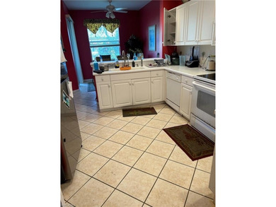 Beautifully Furnished End Unit with Lake Views! Discover the on Cypress Woods Golf and Country Club in Florida - for sale on GolfHomes.com, golf home, golf lot