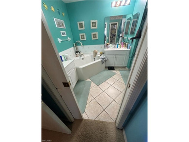 Beautifully Furnished End Unit with Lake Views! Discover the on Cypress Woods Golf and Country Club in Florida - for sale on GolfHomes.com, golf home, golf lot