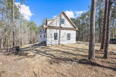 Discover the pinnacle of luxury living in this exceptional new on Reynolds Lake Oconee - The Oconee in Georgia - for sale on GolfHomes.com, golf home, golf lot