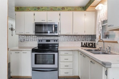 MOVE-IN READY! 2 BED/2 BATH COZY RETREAT - TWO FLORIDA ROOMS - on Bay Tree Golf Course in Florida - for sale on GolfHomes.com, golf home, golf lot