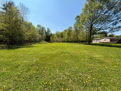 Prime location alert! Nestled on a one-acre lot bordering the on Maplewood Golf Course in Wisconsin - for sale on GolfHomes.com, golf home, golf lot