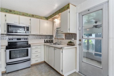 MOVE-IN READY! 2 BED/2 BATH COZY RETREAT - TWO FLORIDA ROOMS - on Bay Tree Golf Course in Florida - for sale on GolfHomes.com, golf home, golf lot