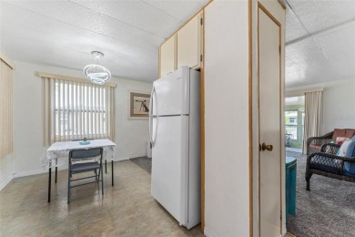 MOVE-IN READY! 2 BED/2 BATH COZY RETREAT - TWO FLORIDA ROOMS - on Bay Tree Golf Course in Florida - for sale on GolfHomes.com, golf home, golf lot