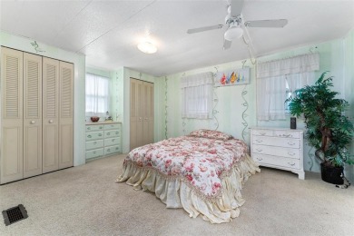 MOVE-IN READY! 2 BED/2 BATH COZY RETREAT - TWO FLORIDA ROOMS - on Bay Tree Golf Course in Florida - for sale on GolfHomes.com, golf home, golf lot