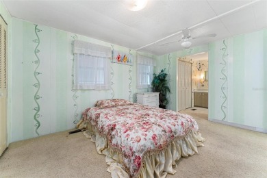 MOVE-IN READY! 2 BED/2 BATH COZY RETREAT - TWO FLORIDA ROOMS - on Bay Tree Golf Course in Florida - for sale on GolfHomes.com, golf home, golf lot
