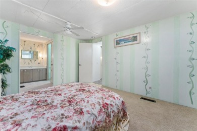 MOVE-IN READY! 2 BED/2 BATH COZY RETREAT - TWO FLORIDA ROOMS - on Bay Tree Golf Course in Florida - for sale on GolfHomes.com, golf home, golf lot