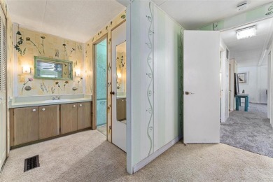 MOVE-IN READY! 2 BED/2 BATH COZY RETREAT - TWO FLORIDA ROOMS - on Bay Tree Golf Course in Florida - for sale on GolfHomes.com, golf home, golf lot