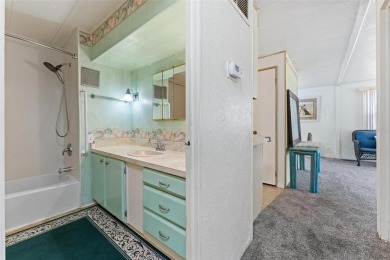 MOVE-IN READY! 2 BED/2 BATH COZY RETREAT - TWO FLORIDA ROOMS - on Bay Tree Golf Course in Florida - for sale on GolfHomes.com, golf home, golf lot